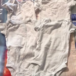 4 pack plain white onsies.